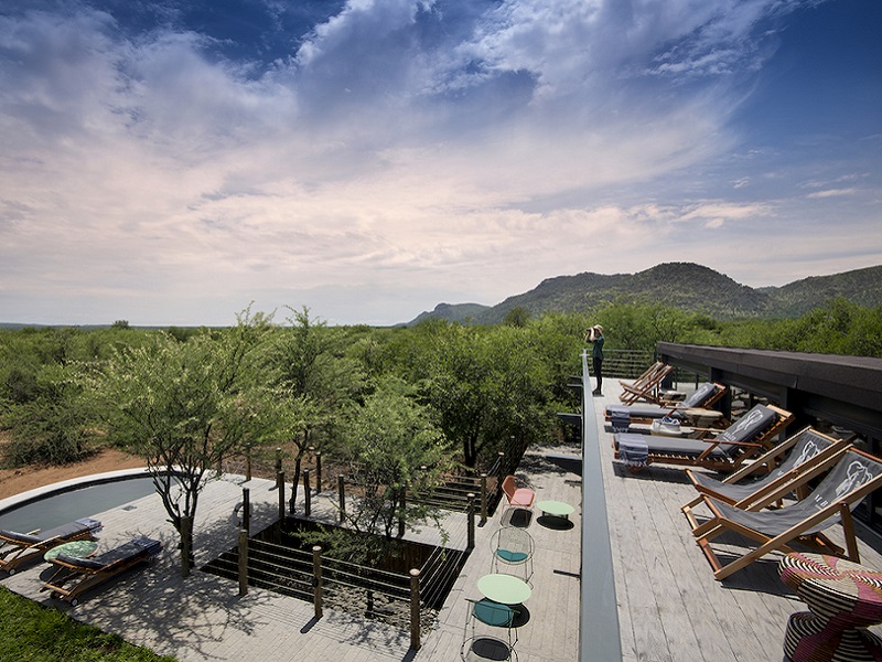 Mbazo Safari Lodge pool and deck overlooking the bush