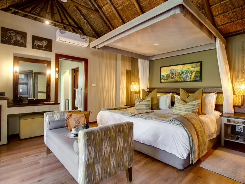 Bed in a room at Ivory Tree Game Lodge